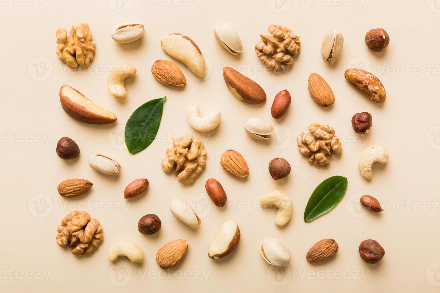 Composition of nuts , mix hazelnuts, cashews, almonds on table background. healthy eating concepts photo