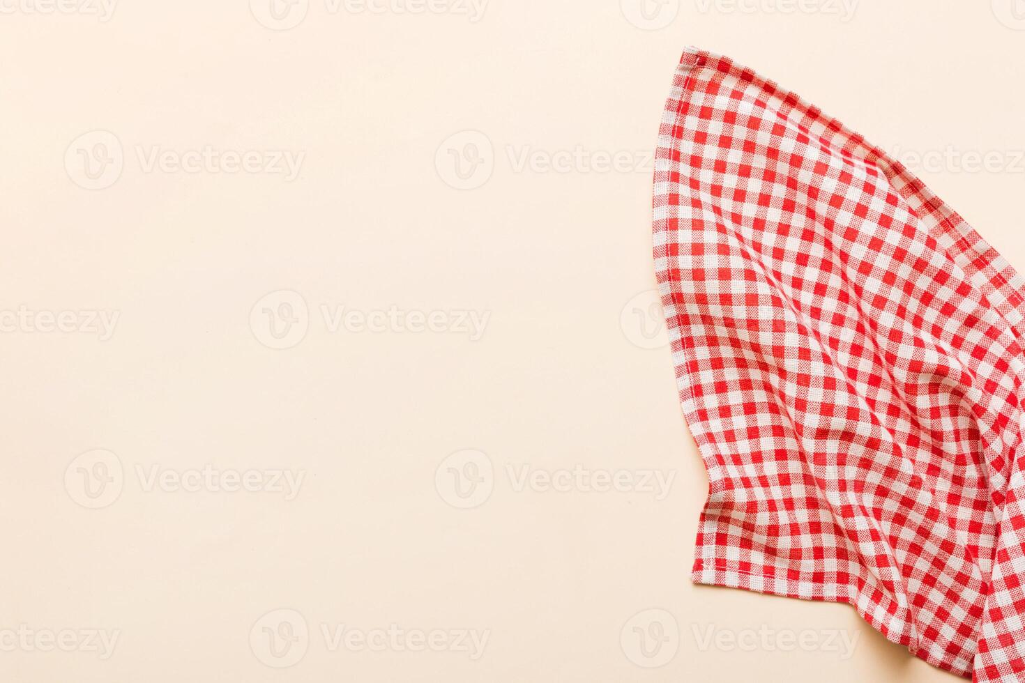top view with red empty kitchen napkin isolated on table background. Folded cloth for mockup , photo