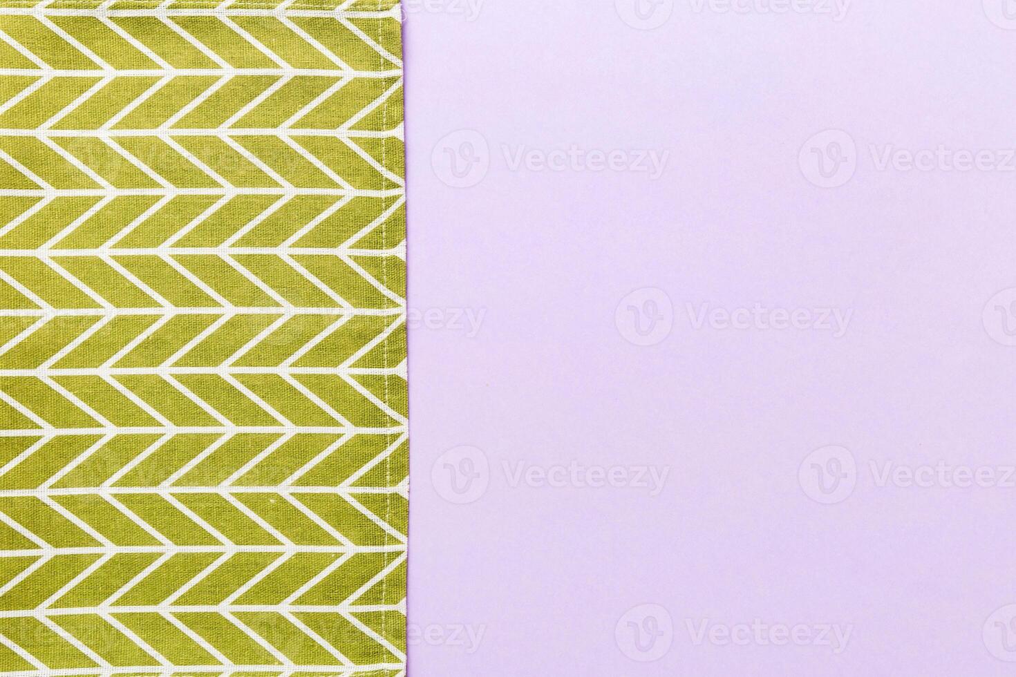 top view green kitchen napkin isolated on table background. Folded cloth for mockup photo