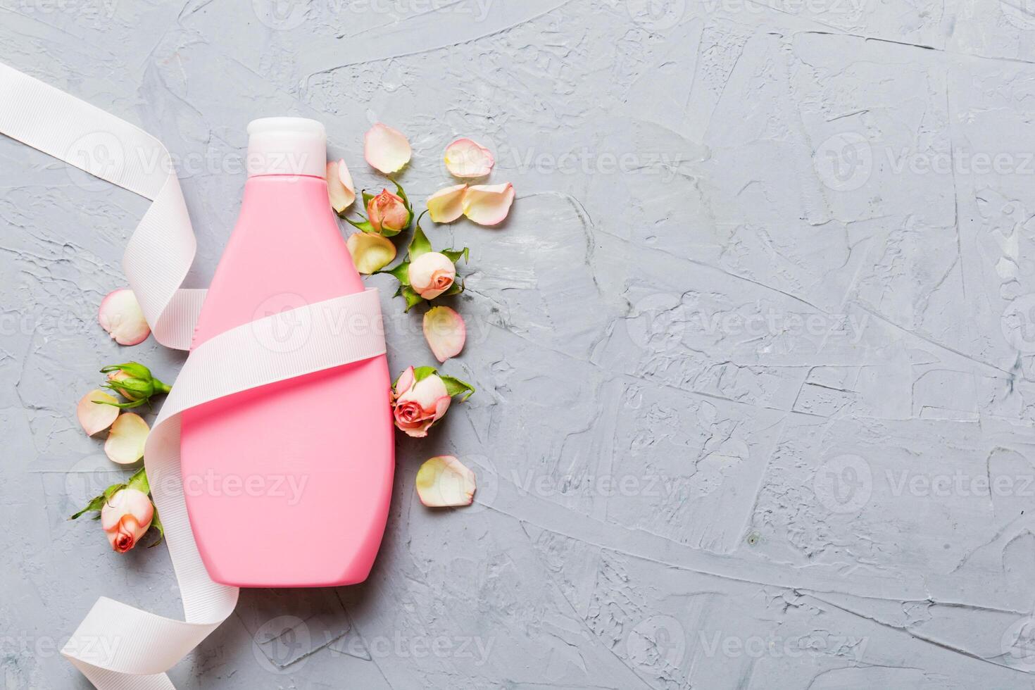 Fancy healthcare bottles for cream with rose flower. Natural oranic spa cosmetics concept. Mockup photo