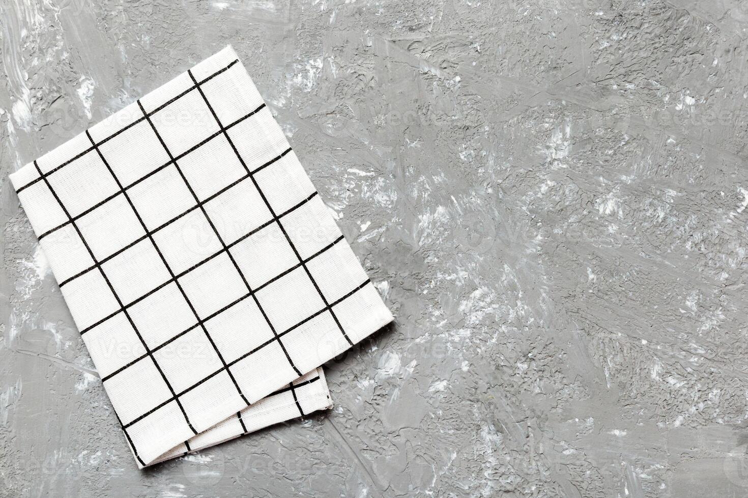 top view with white empty kitchen napkin isolated on table background. Folded cloth photo