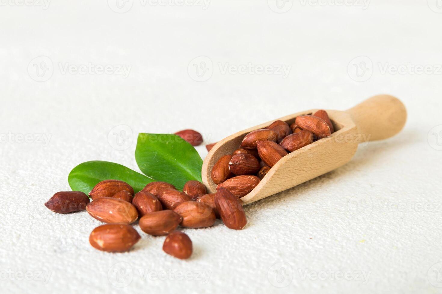 Fresh healthy peanut in spoon on colored table background. Top view Healthy eating concept. photo