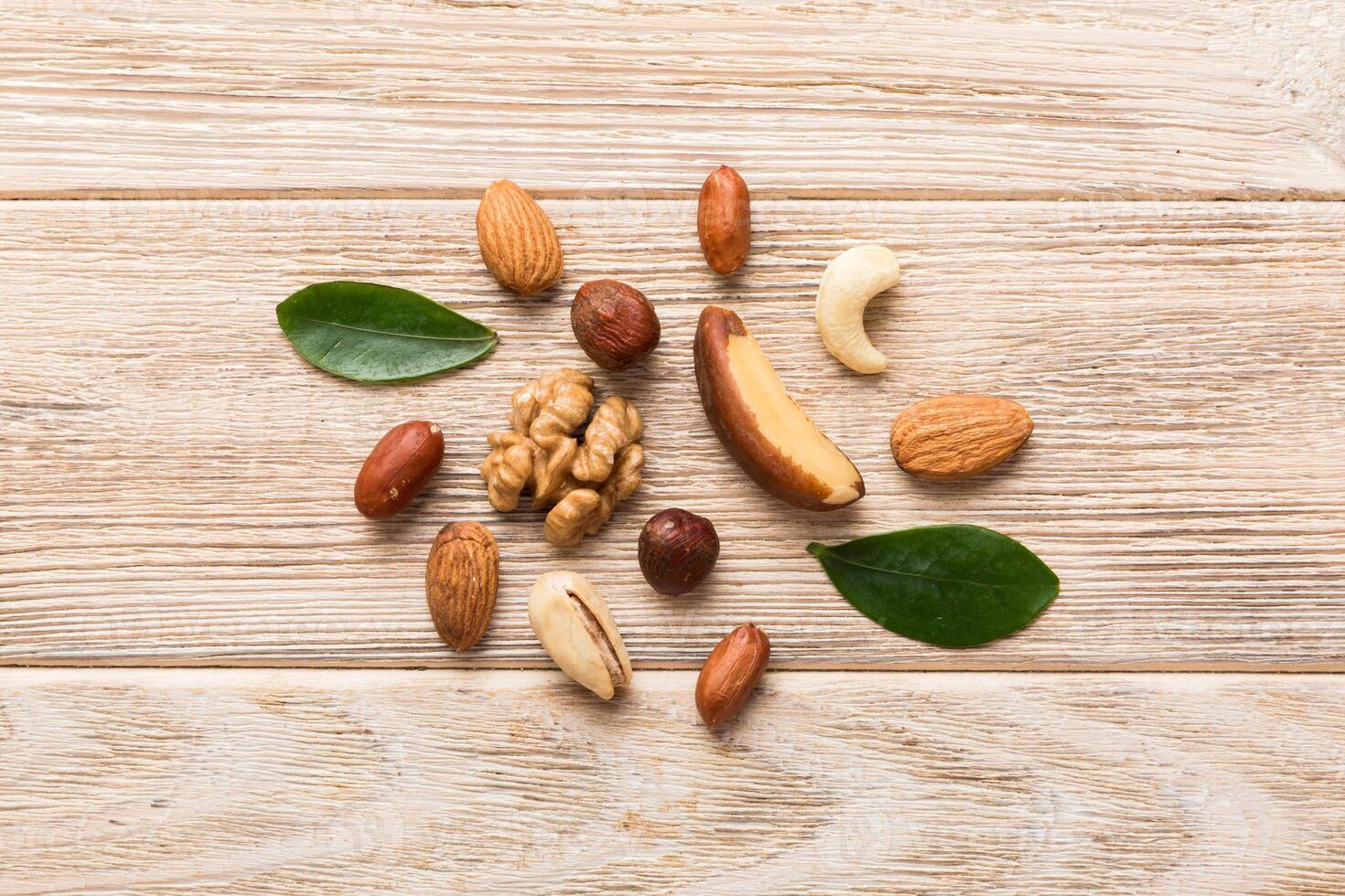 Composition of nuts , mix hazelnuts, cashews, almonds on table . healthy eating concepts photo