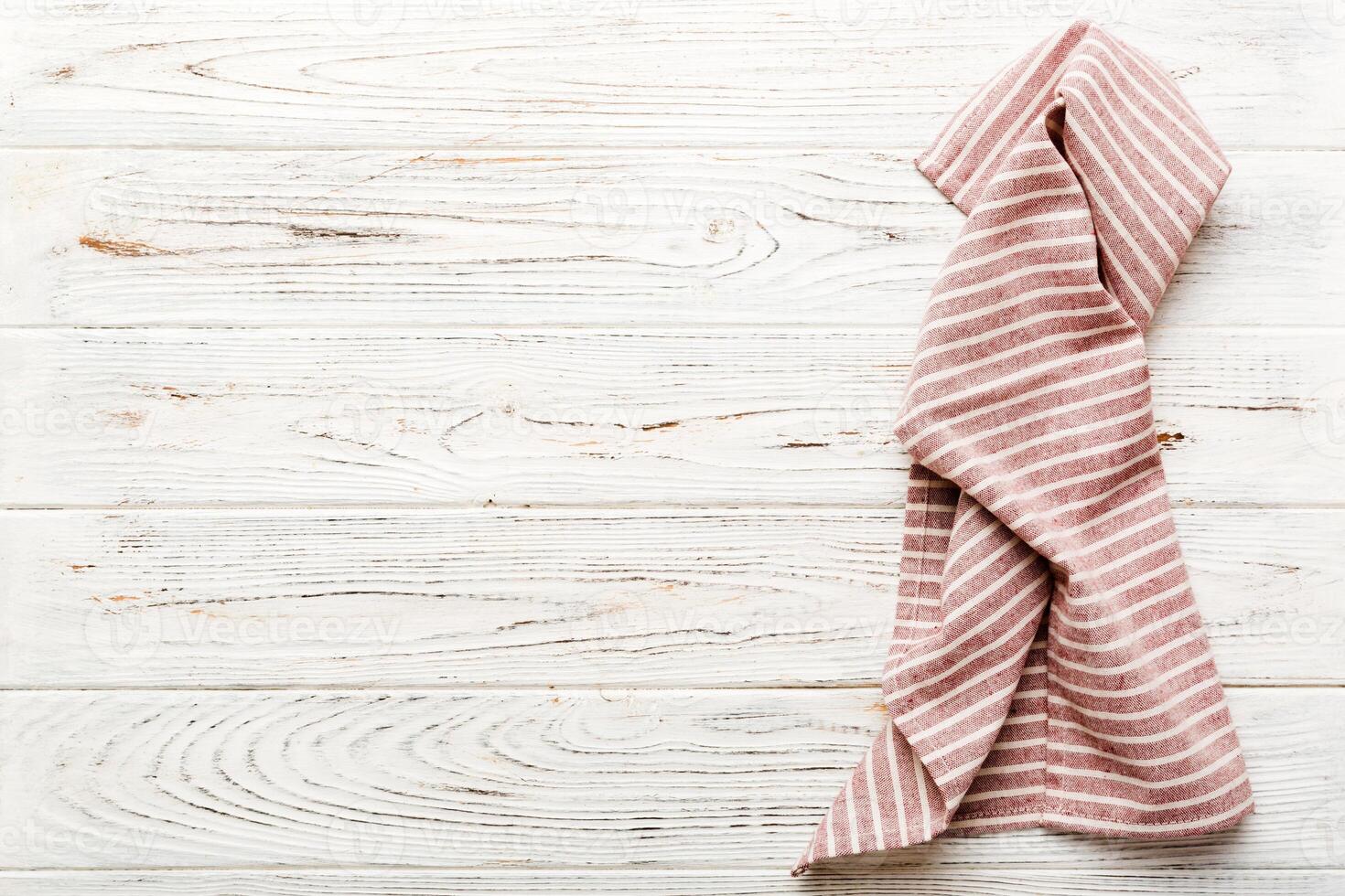 top view with red empty kitchen napkin isolated on table background. photo