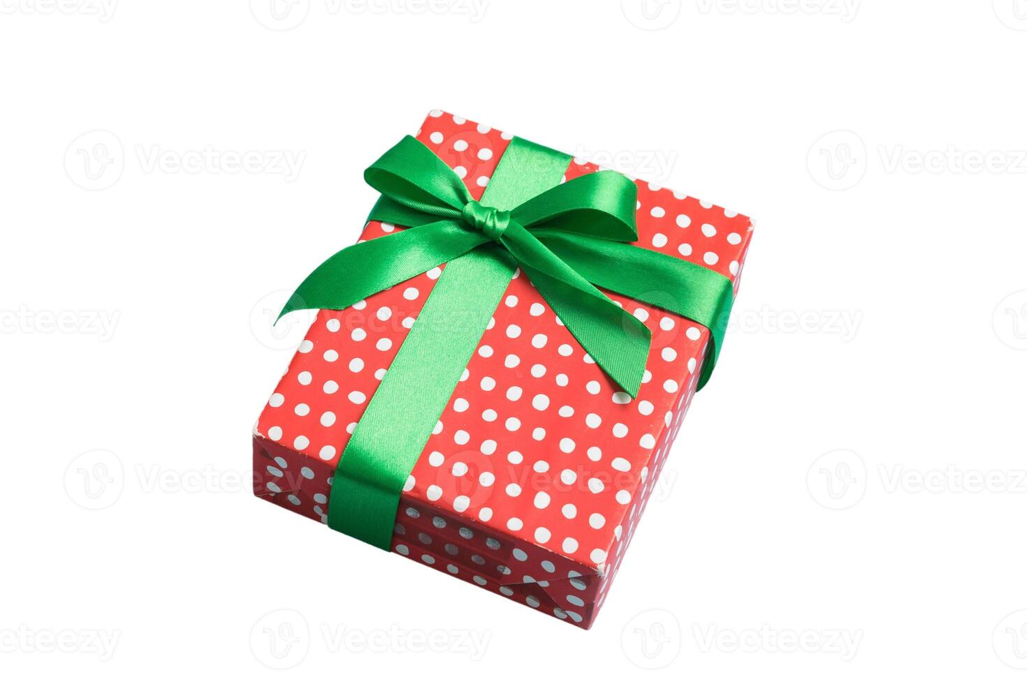 Wrapped christmas other holiday handmade present in paper with colored ribbon. Present box, decoration gift on table photo