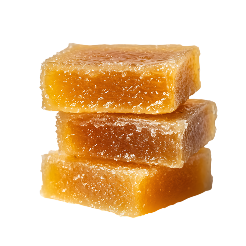 Stack of three amber colored candied ginger pieces isolated on transparent background png