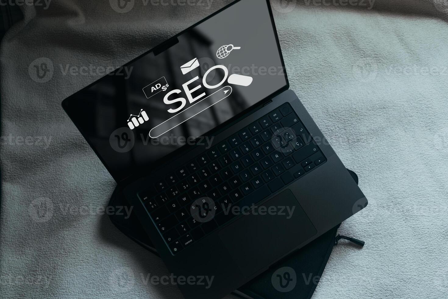 Laptop with SEO icons for analysis on screen. SEO Search Engine optimizing your website to rank in search engines. best promoting ranking traffic on your website. photo