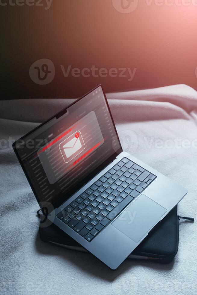 Cyber security on internet concept. Email spam notification alert with warning caution on laptop scree. Compromised information. photo