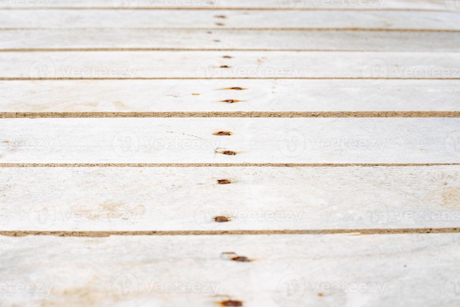 Large texture of light wooden planks with nails and veins and proper wear, selective focus photo