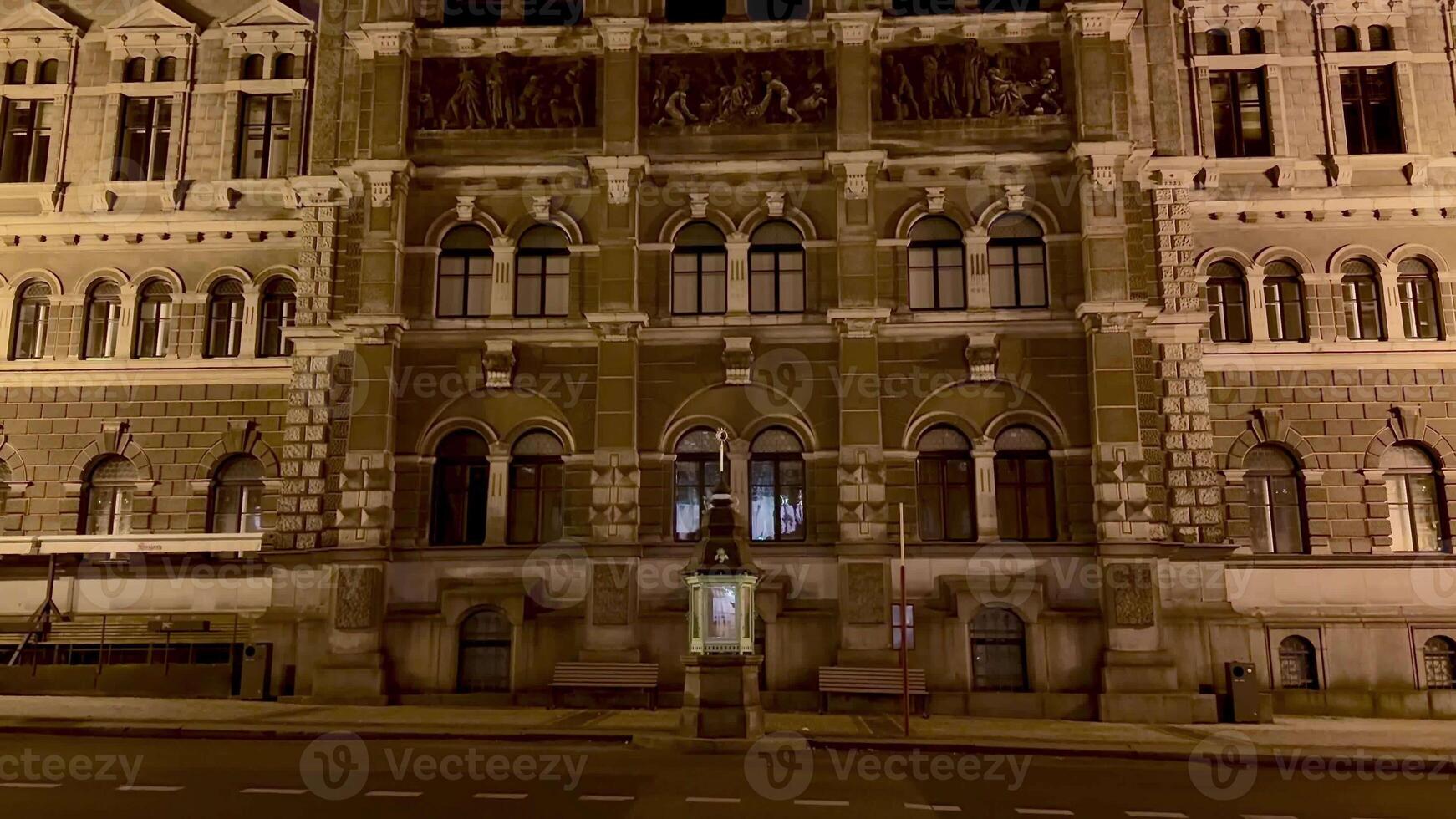 A beautifully illuminated historic building elegantly showcasing its intricate architectural details at night photo