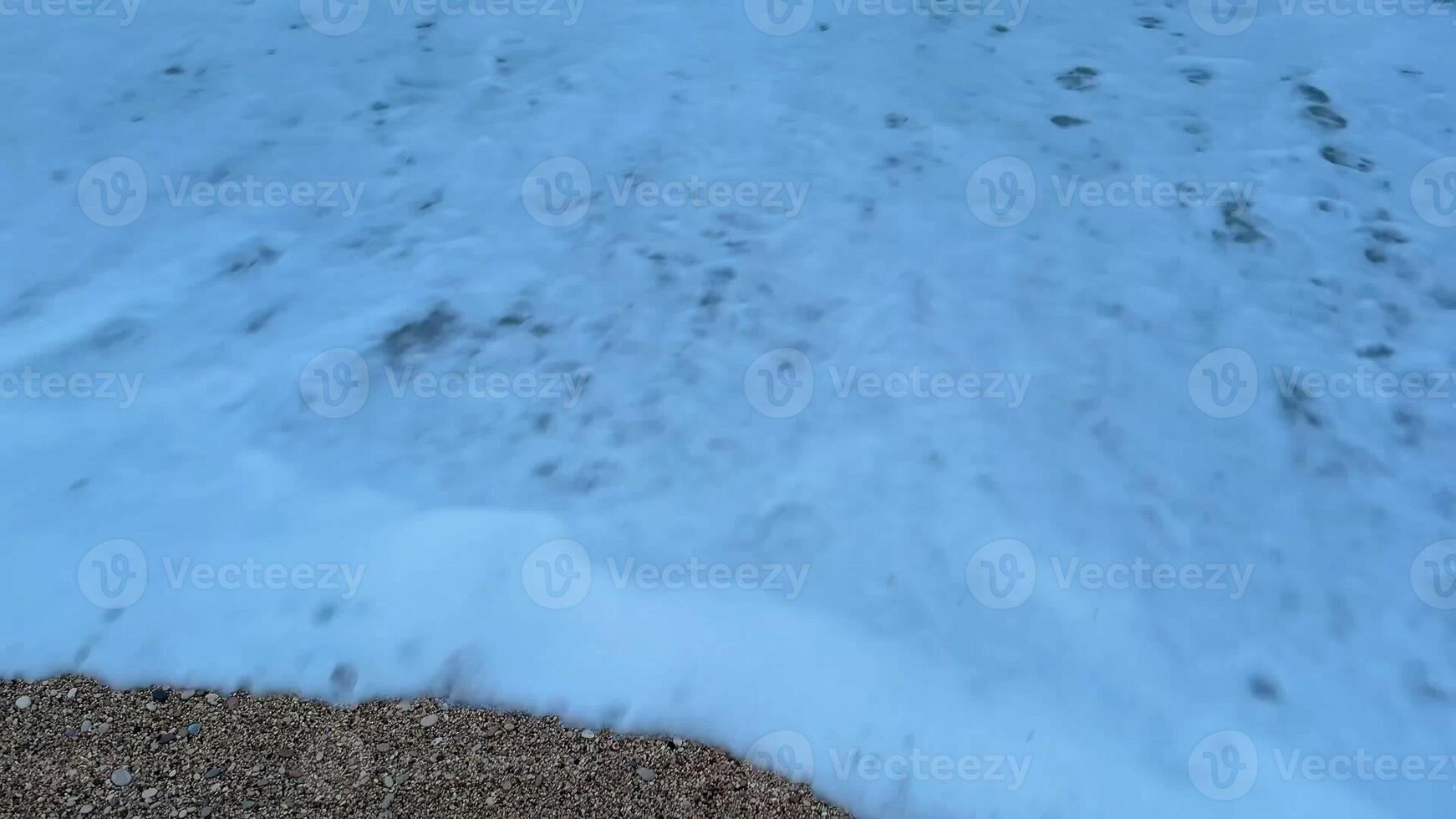 Serene ocean waves are gently crashing softly and rhythmically on the sandy beach during the beautiful twilight hour photo