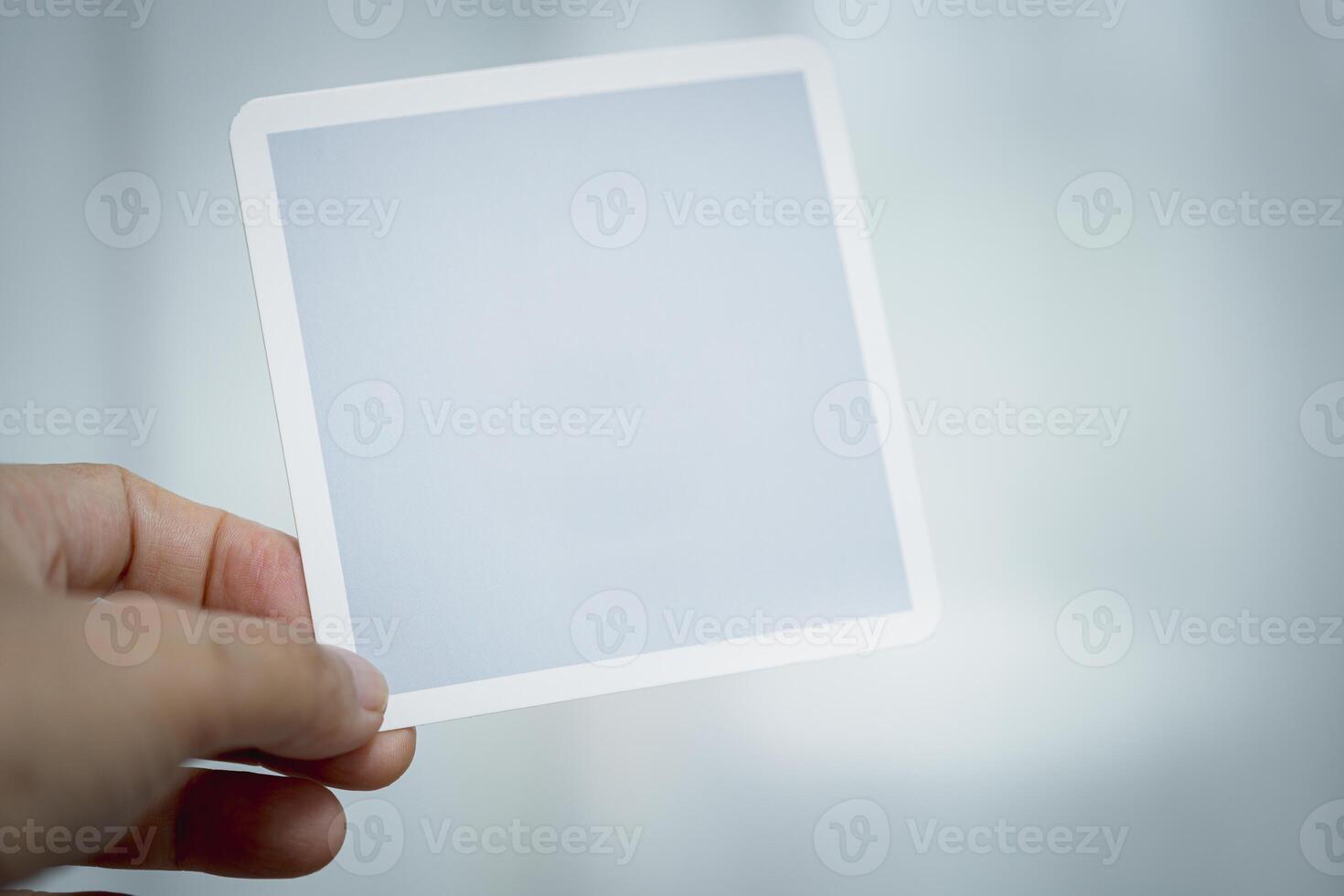 Hand Holding Blank Card, Symbolizing Simplicity, Potential, and Creative Possibilities photo