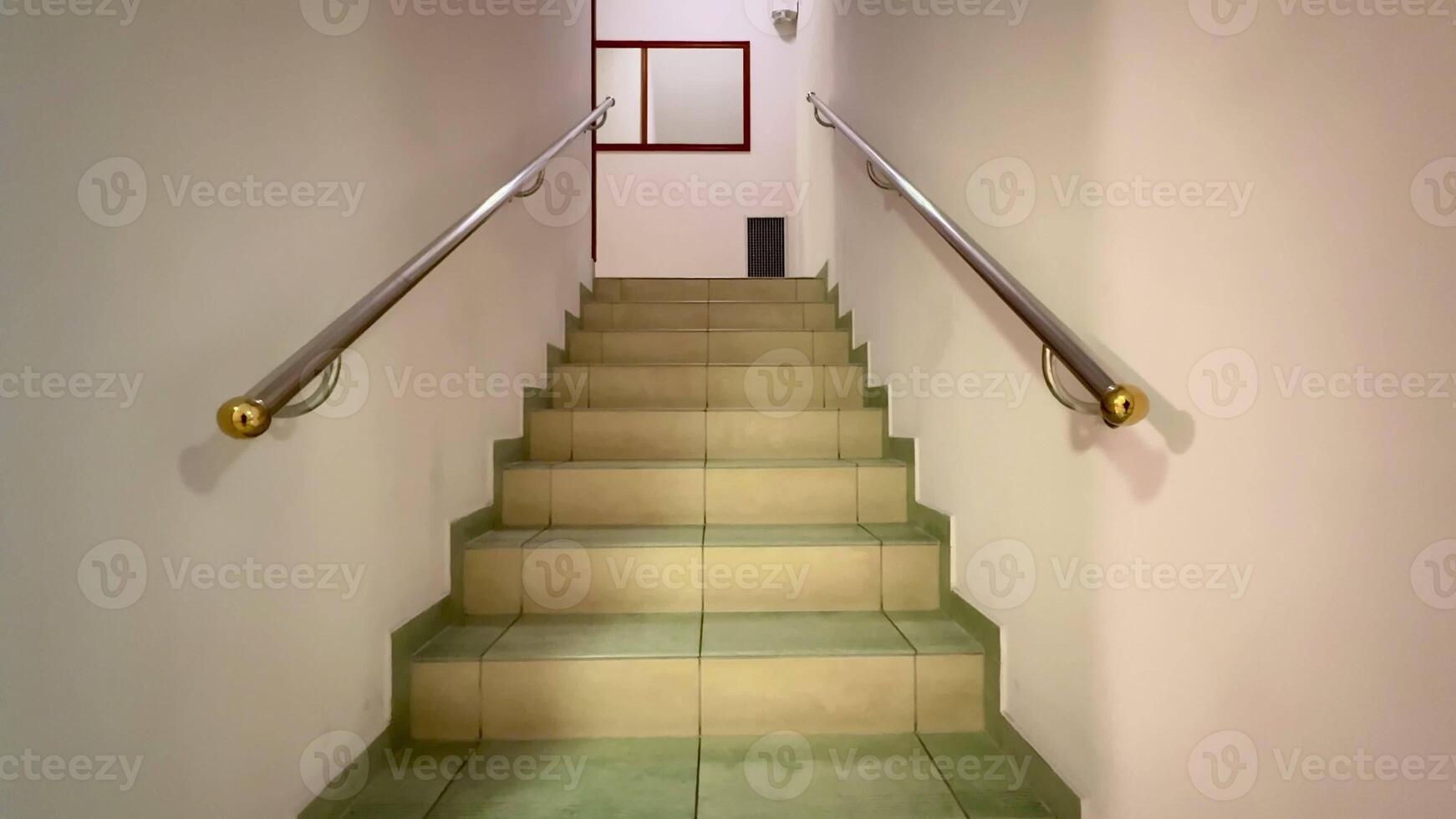 A serene view of a lovely staircase with stylish handrails invites exploration and encourages upward movement photo
