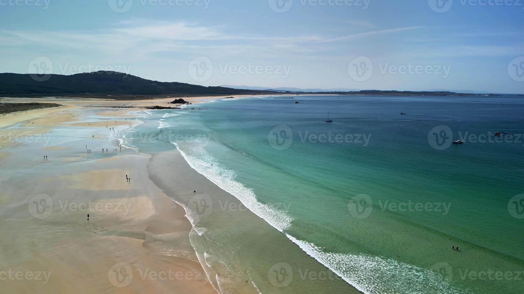 Experience the serene beauty of a picturesque beach with clear waters and soft sandy shores, perfect for relaxation photo