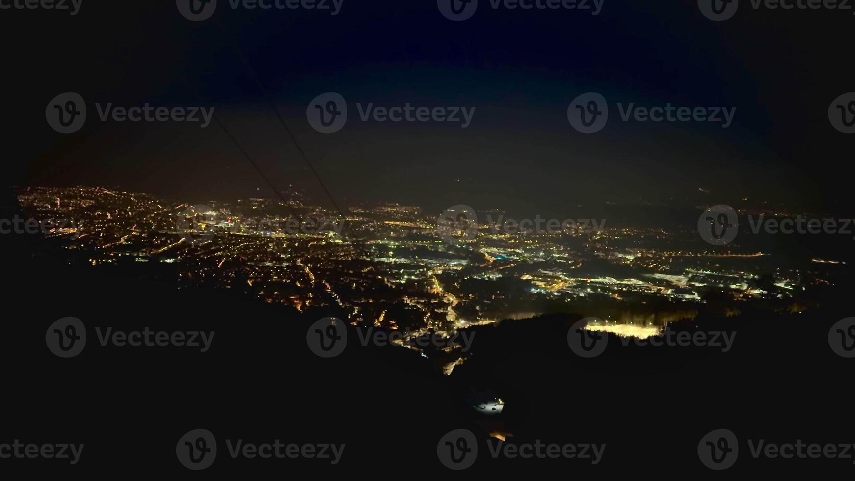 The city of Liberec at night, view from the mountain with zoom. High quality 4k footage photo