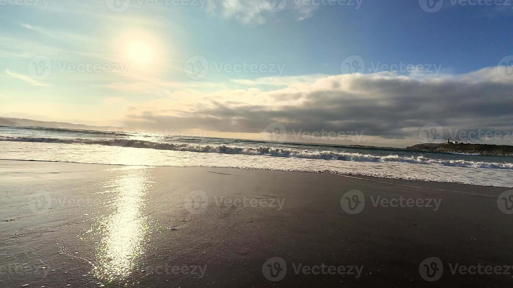 A stunning sunset reflects beautifully on the gentle waves of the beach, showcasing natures incredible beauty photo