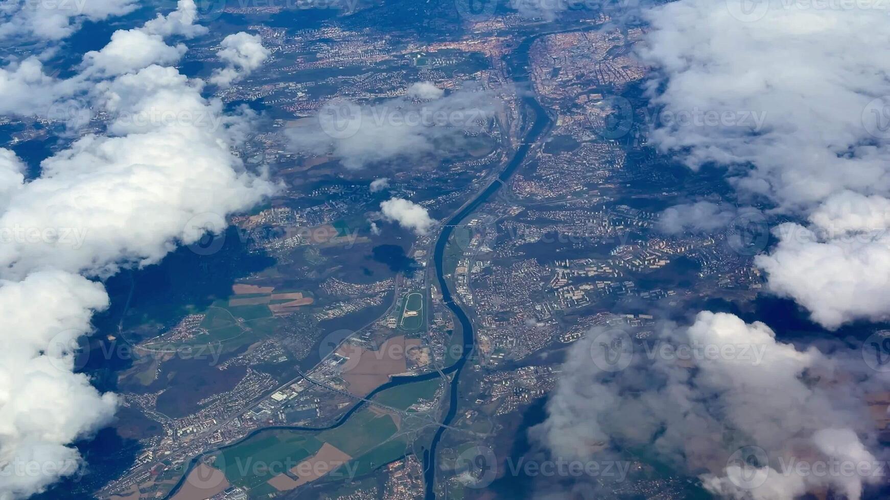 Experience stunning aerial imagery showcasing the beauty of rivers, clouds, and diverse landscapes from above photo