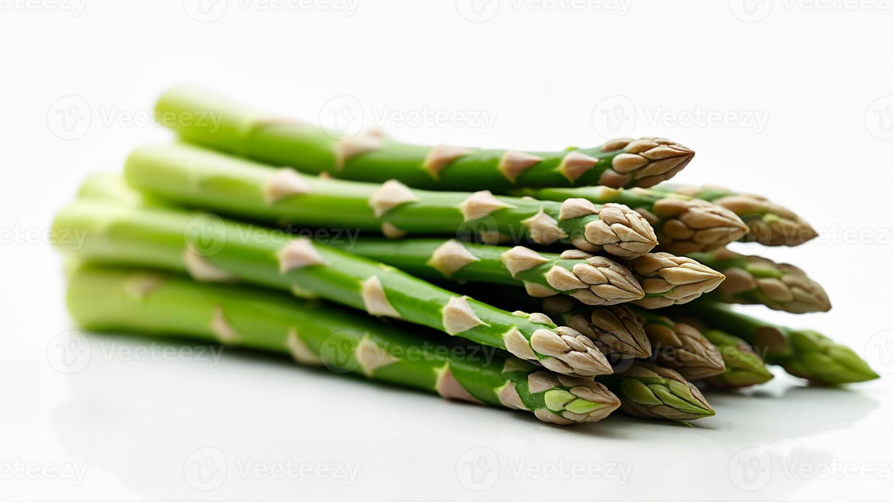 A bundle of fresh green asparagus spears is isolated on a white background. For illustrating healthy food, vegetables, or cooking ingredients. photo