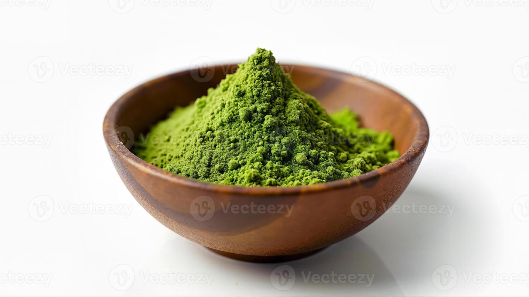 A heap of green matcha powder in a wooden bowl, isolated on a white background. Suitable for illustrating culinary, health, or tea-related theme. photo