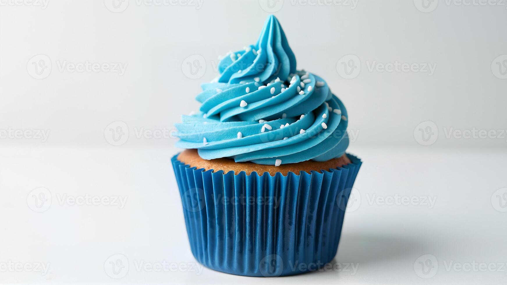 Single cupcake with blue icing and white sprinkles isolated on a white background. Suitable for bakery, dessert, or celebration themes. photo