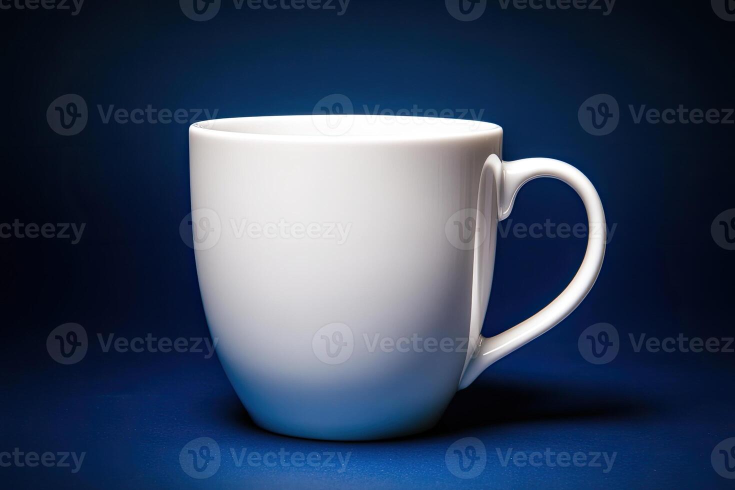 A single white ceramic mug on a blue background photo