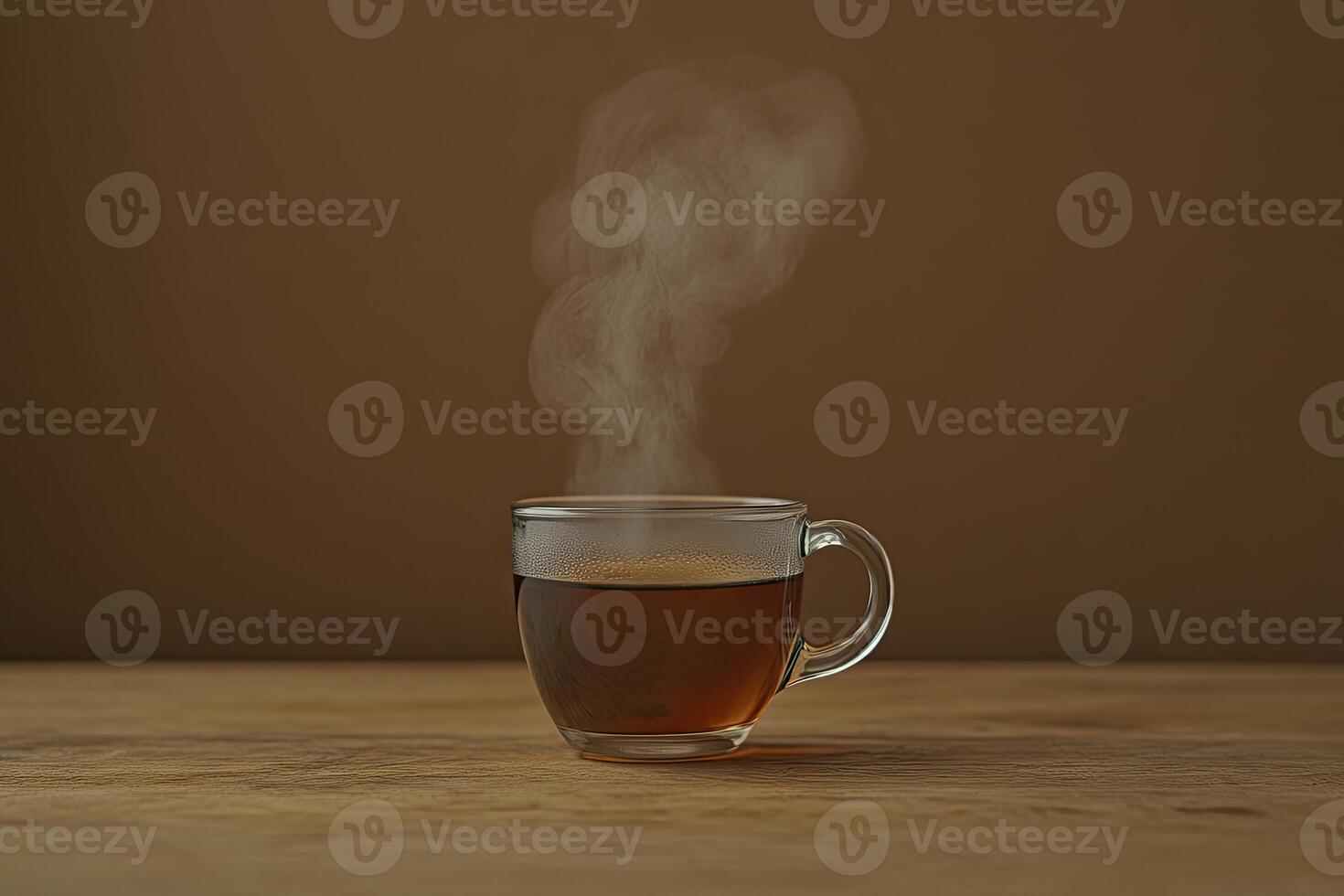 A Glass of Steaming Hot Tea on Wood photo