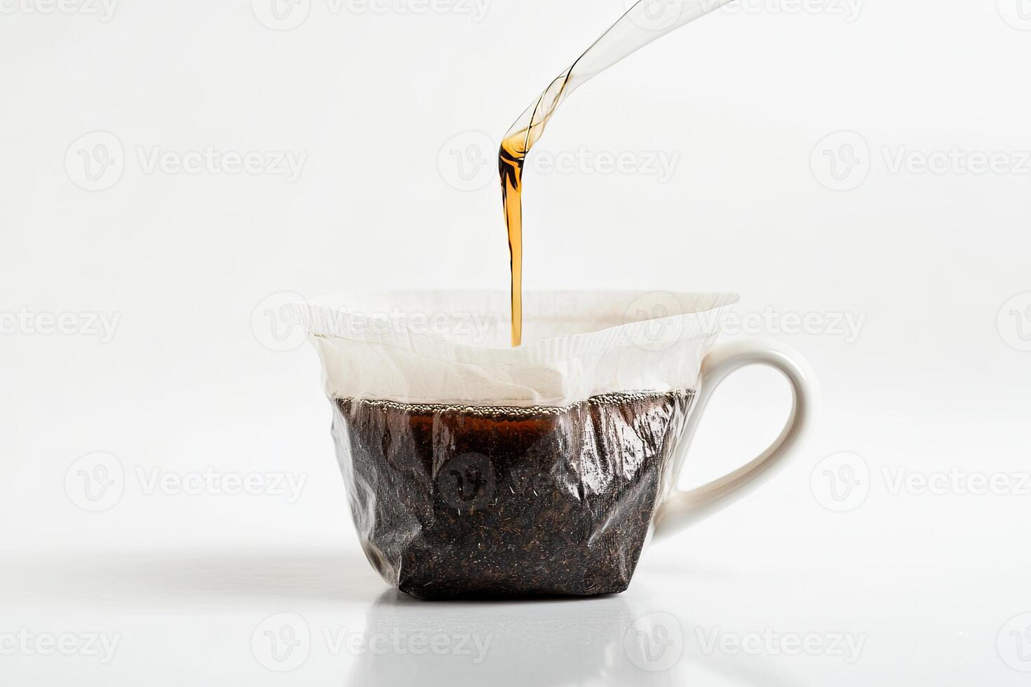 Brewing Tea Into A White Mug Using A Filter photo