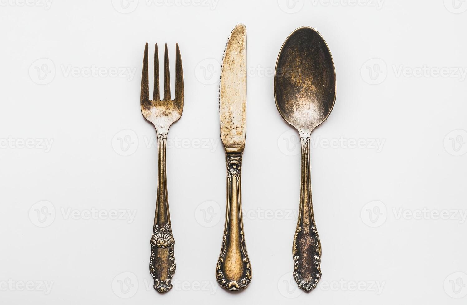 Antique Silverware Set Featuring Fork Knife and Spoon photo