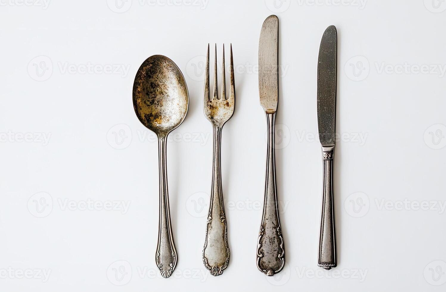 Antique Silverware Set Spoon Fork Knives Arranged photo