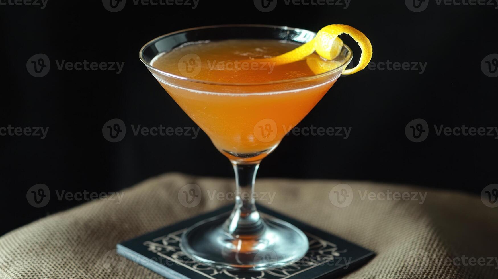 An Orange Twist Garnishes A Classic Cocktail Drink photo