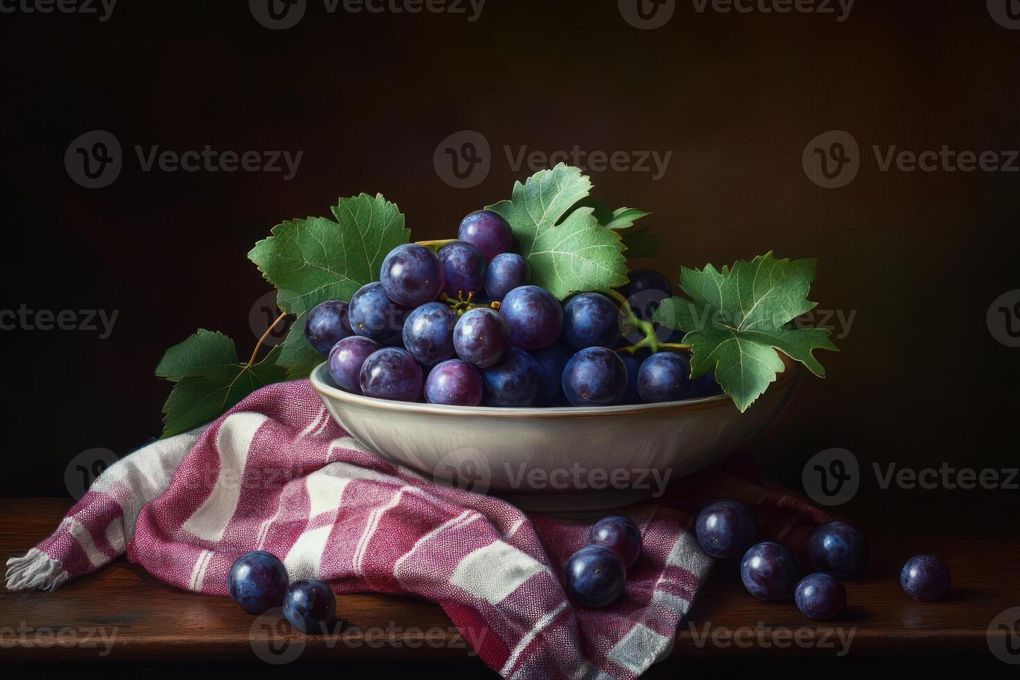 Dark Grapes in Bowl with Leaves and Cloth photo