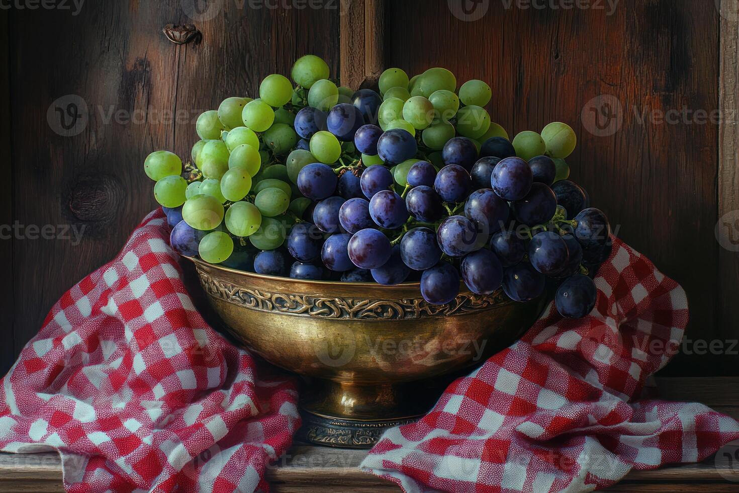 Green and Purple Grapes in Antique Bowl on Red Cloth photo