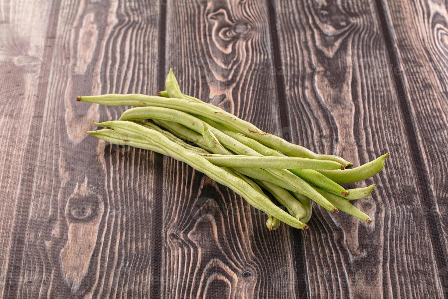 Fresh green beans on a wooden table photo