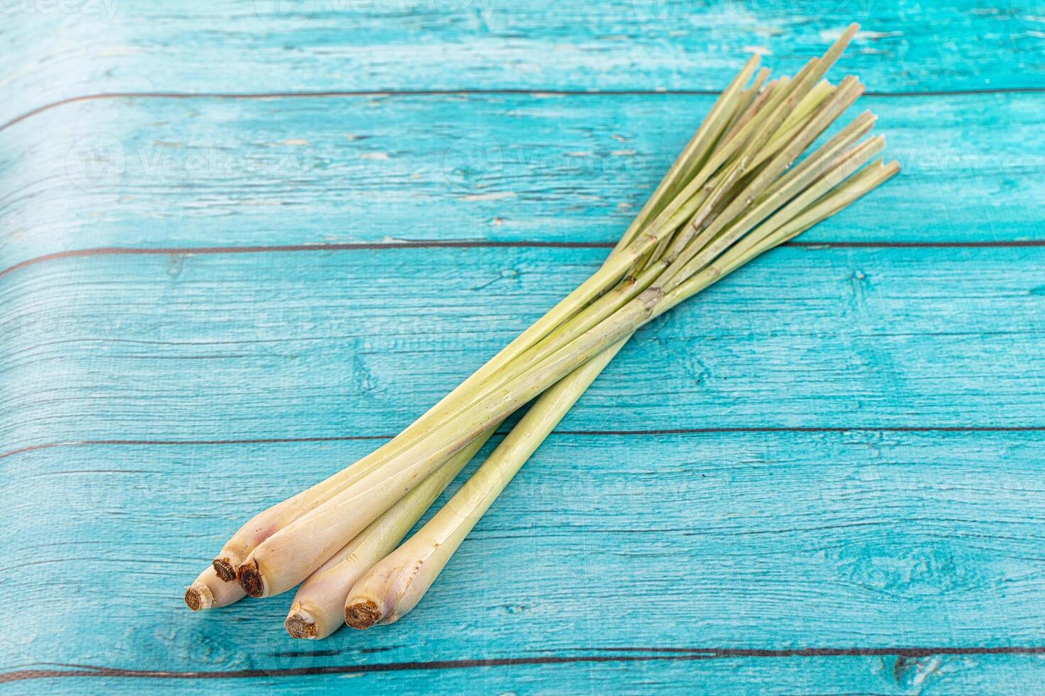 Fresh lemongrass on a wooden table photo