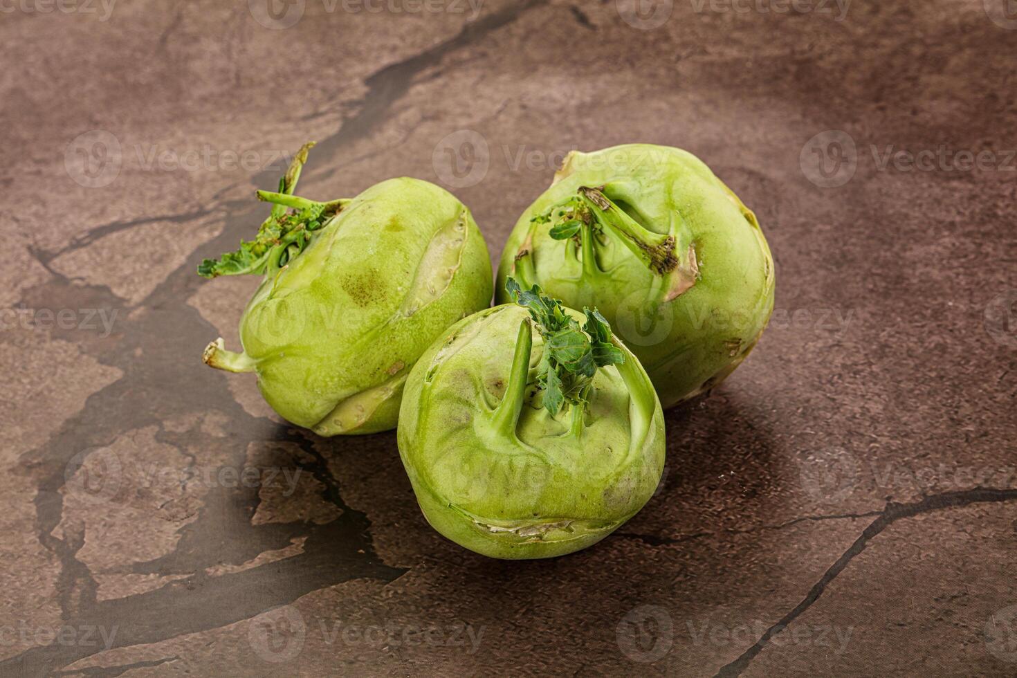 Three green fruits on a table photo