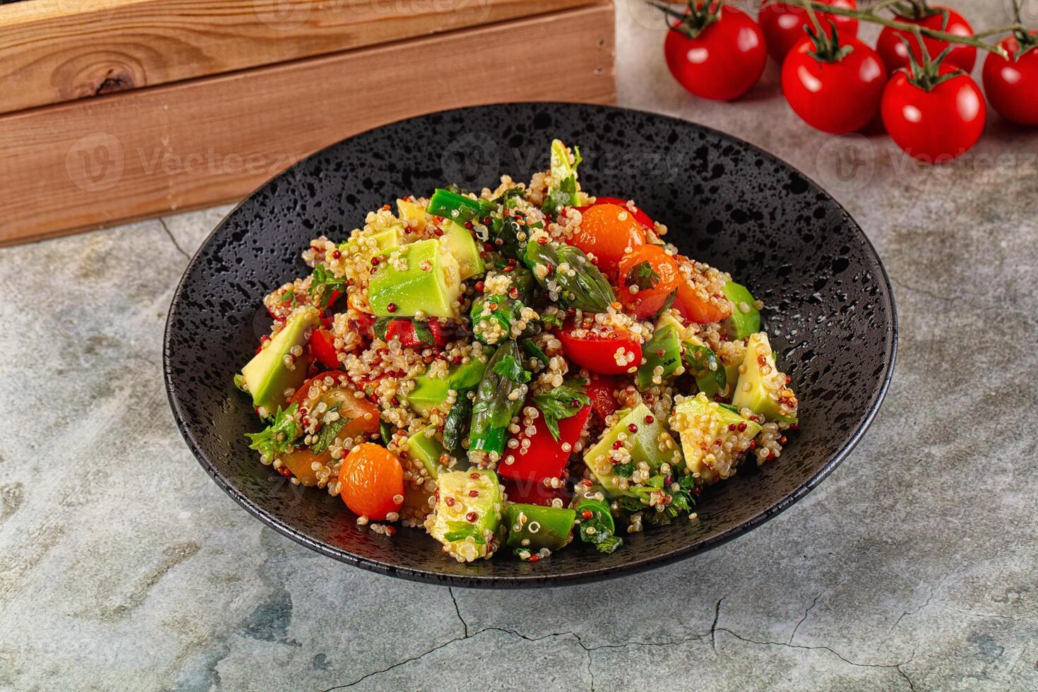 A bowl of quinoa salad with tomatoes and asparagus photo