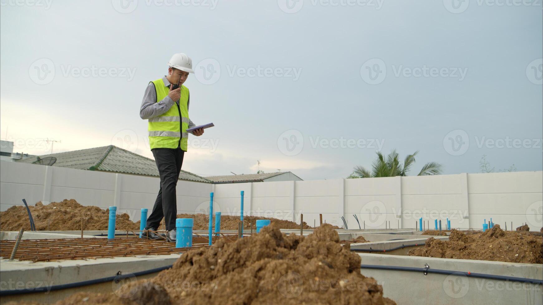Engineers supervise construction work and inspect the foundation work of residential buildings,86 photo