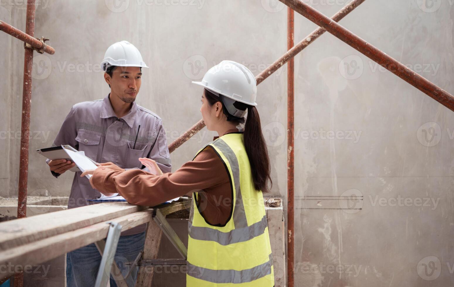 Engineers and architecture inspect and supervise the construction of building walls,24 photo
