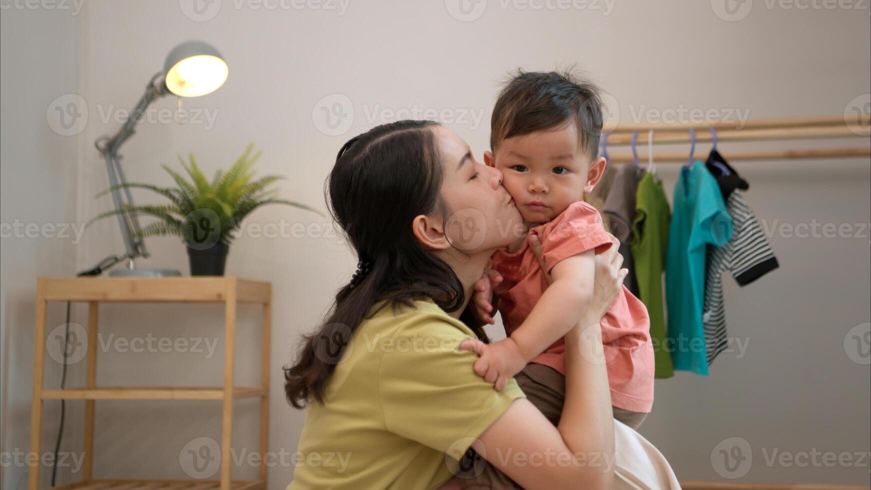 Little boy with breakfast with mom feeding him before bathing him,332 photo