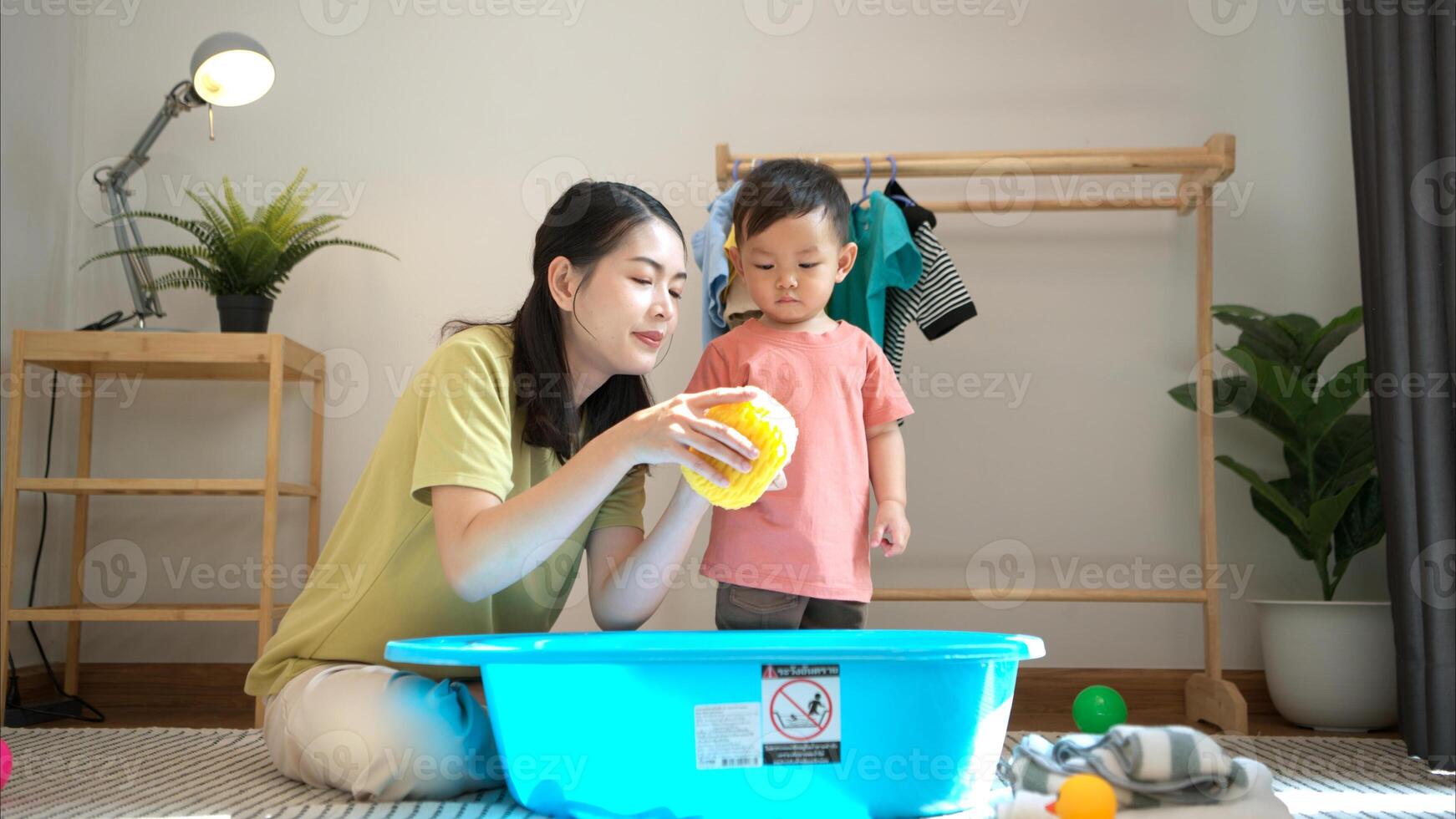 Little boy with play and breakfast with mom feeding him before bathing him,324 photo
