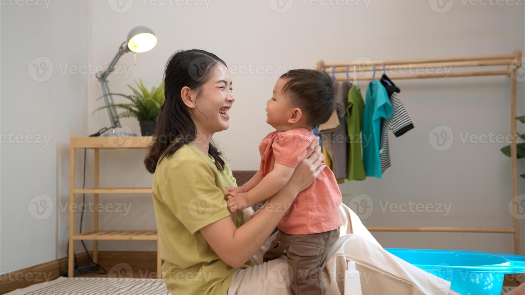 Little boy with breakfast with mom feeding him before bathing him,312 photo