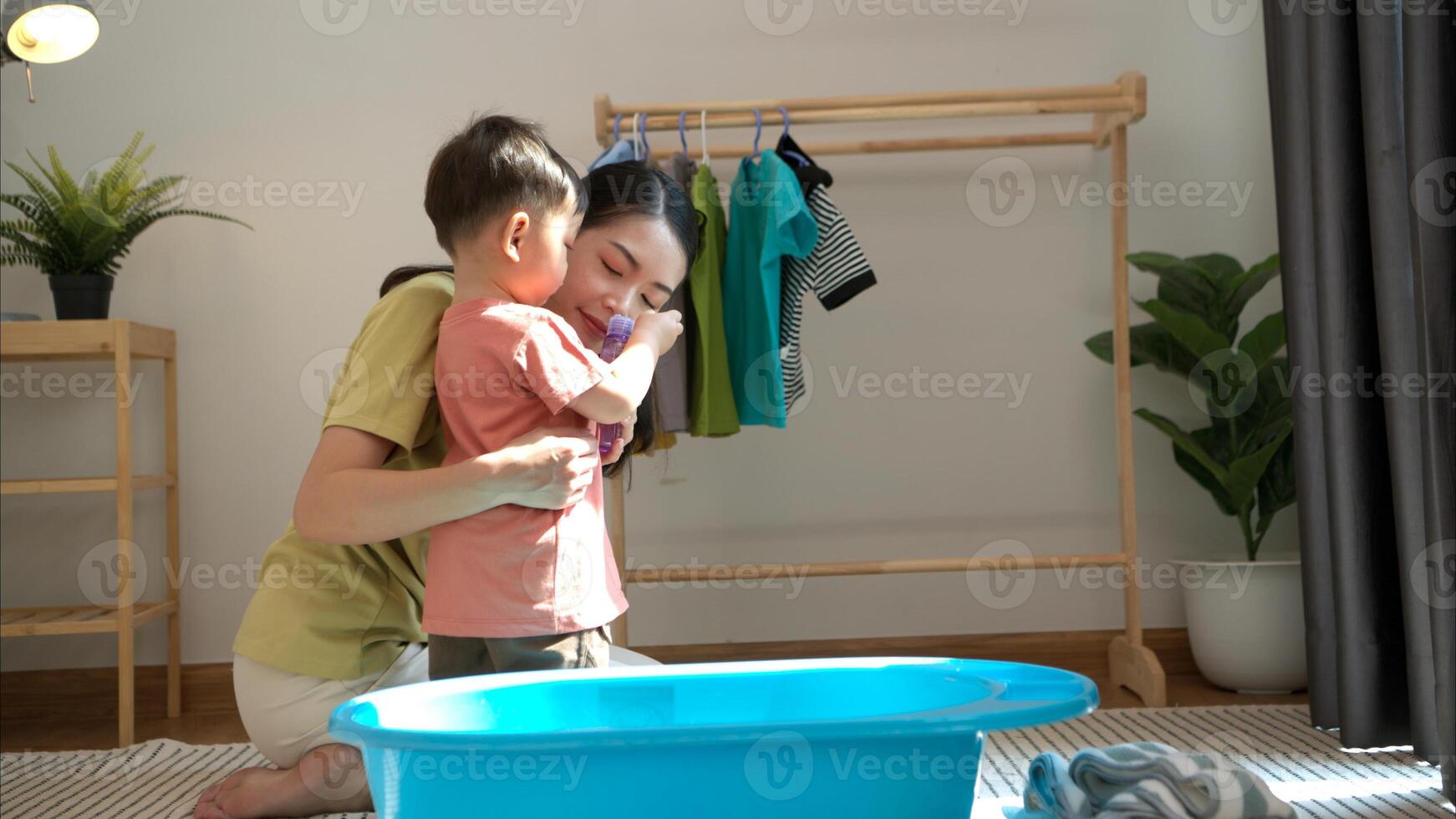 Mom and little child with taking a shower and dressing at home in the morning,313 photo