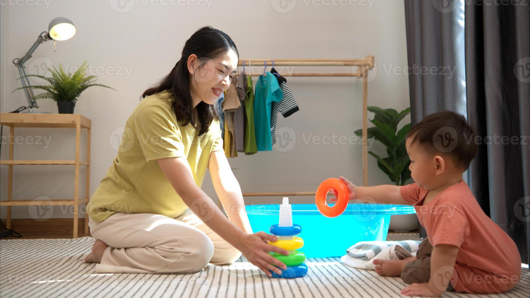 Little boy with play and breakfast with mom feeding him before bathing him,306 photo