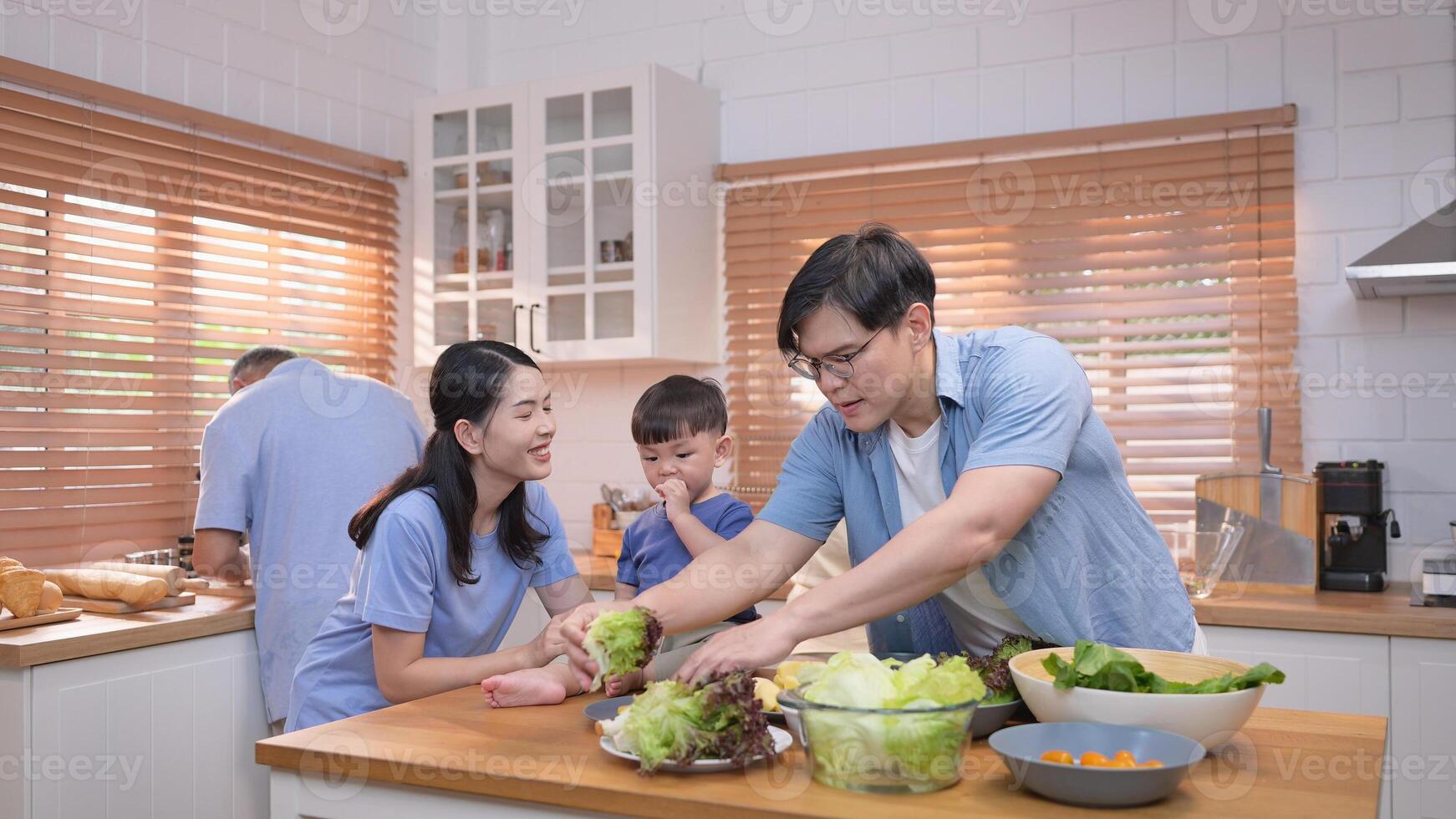 Happy Asian family preparing food together in a bright kitchen,241 photo