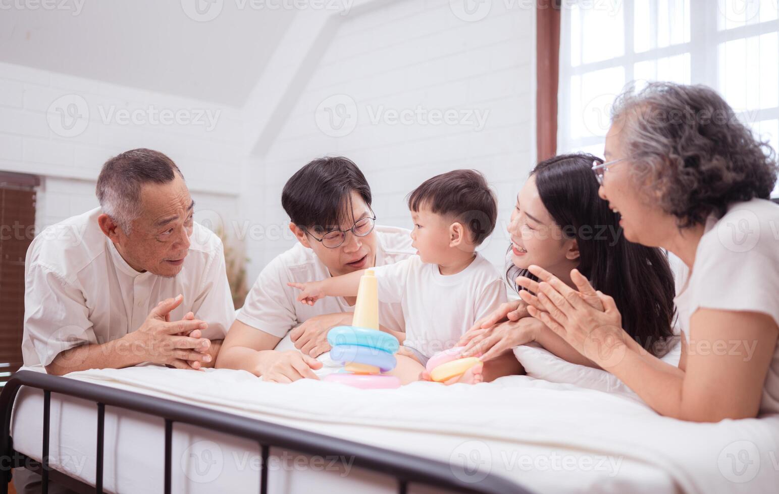 Before putting the kids to bed, parents, grandparents, and kid unwind and play in the bedroom,196 photo