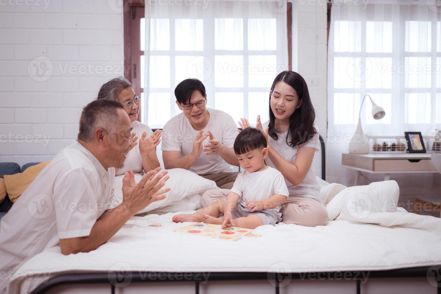 Before putting the kids to bed, parents, grandparents, and kid unwind and play in the bedroom,165 photo