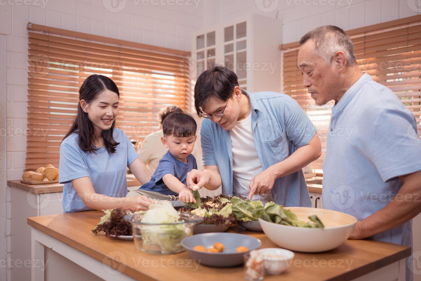 Happy Asian family preparing food together in a bright kitchen,98 photo
