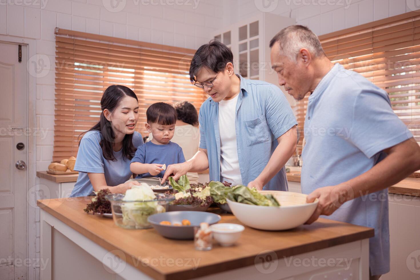 Happy Asian family preparing food together in a bright kitchen,66 photo