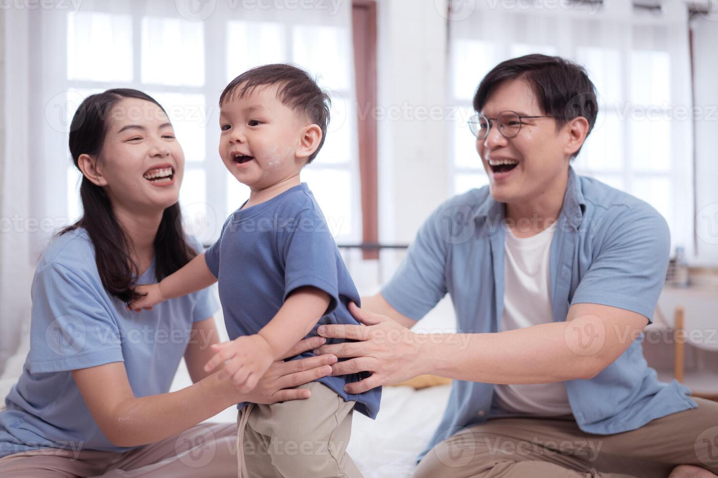 Asian kid and parents enjoying are having fun applying cream, powder and dressing up,63 photo