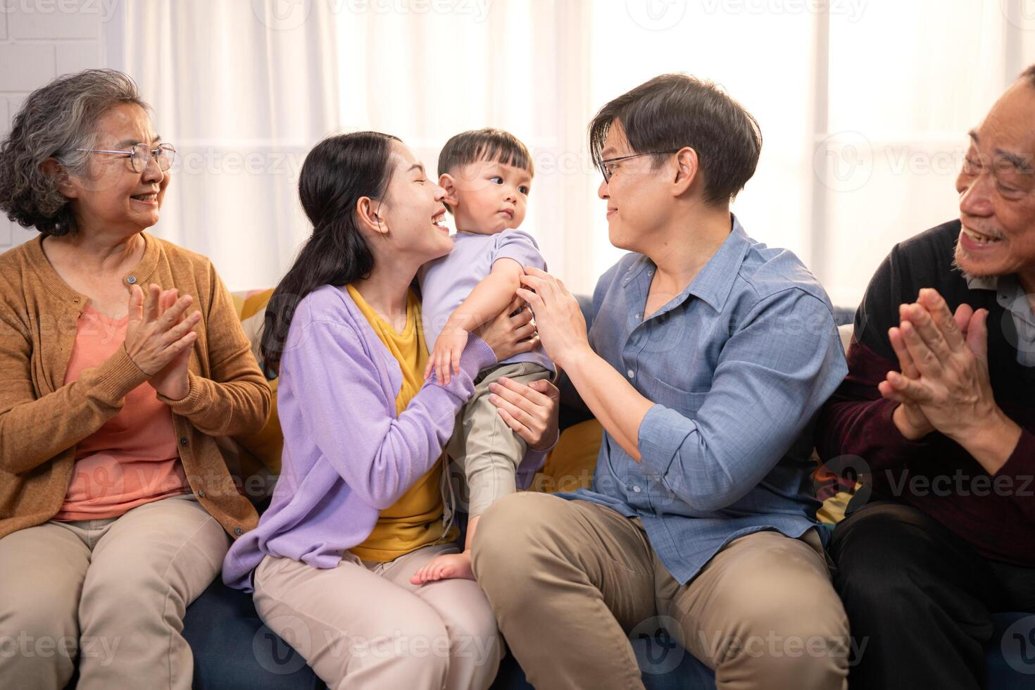 Happy multi-generational Asian family enjoying quality time together at home,22 photo
